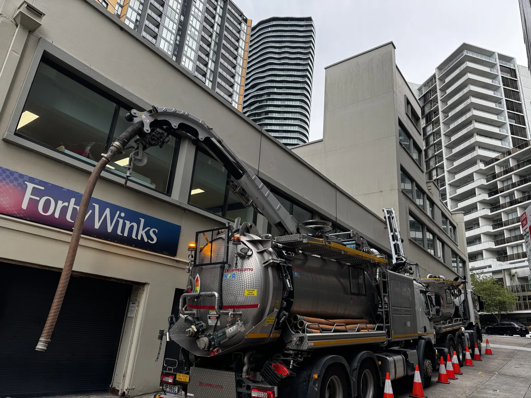 Eire Vacuum Services truck positioned for hose access on a Sydney planter box clean-out job